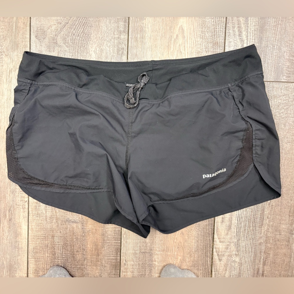 Patagonia Women's Size LG Strider athletic shorts in black.